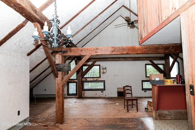 interior space with lofted ceiling with beams and an inviting chandelier