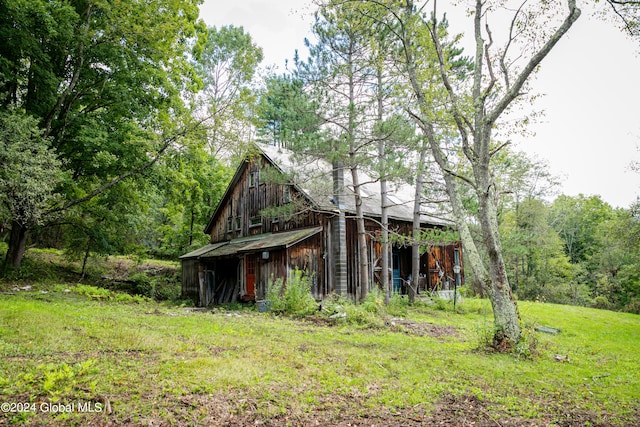 view of home's exterior with a yard