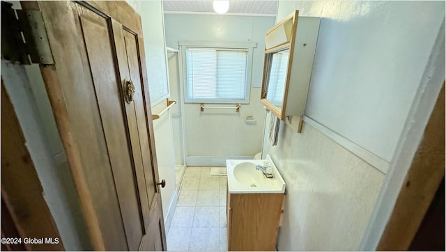 bathroom with vanity and tile patterned flooring