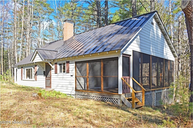 exterior space with a sunroom