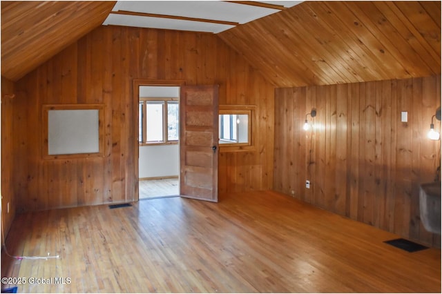 67 Adams Ln, Schroon, NY 12870 - additional living space with lofted ceiling, wooden walls, and wood finished floors