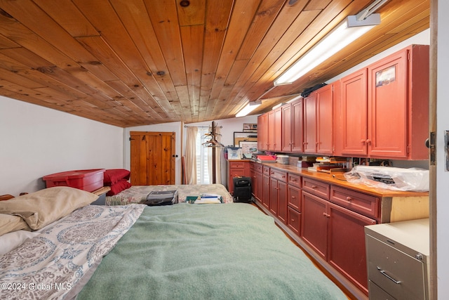 bedroom featuring wood ceiling and lofted ceiling