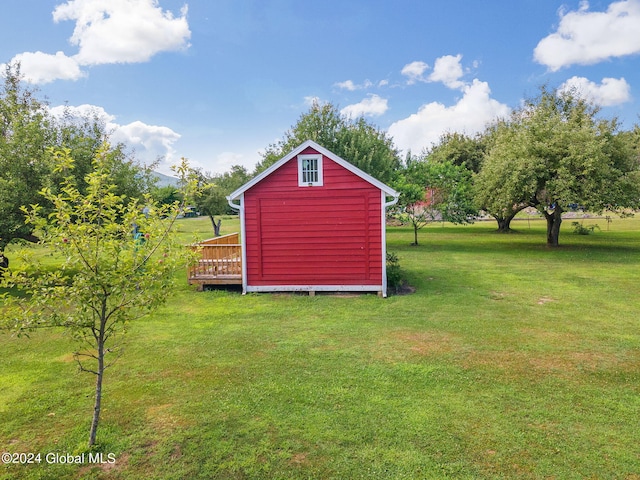 view of outbuilding with a lawn