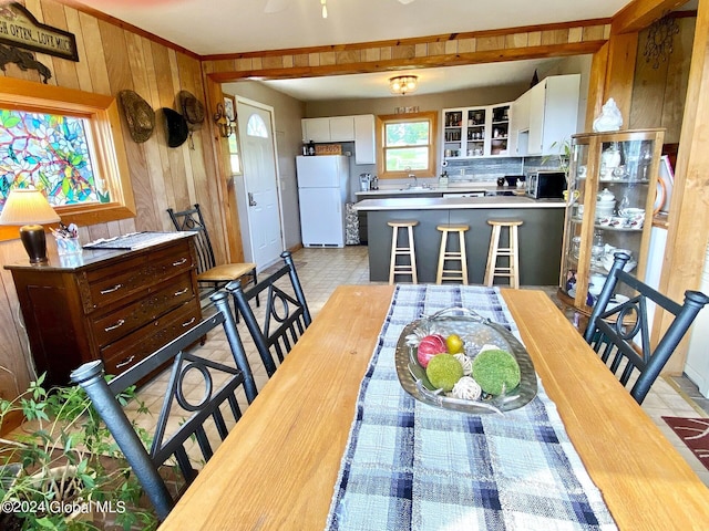 dining space with wooden walls