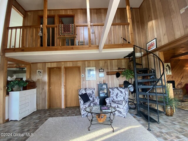 living room with wood walls