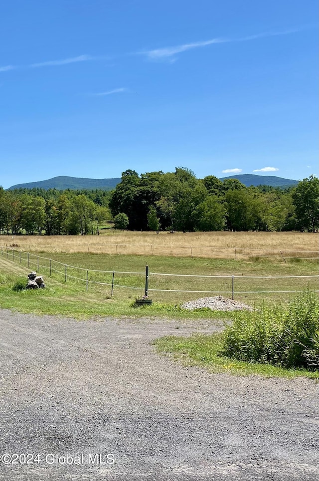 mountain view featuring a rural view