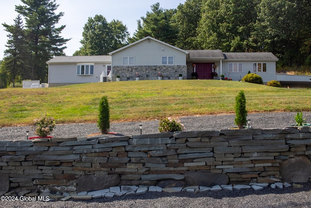 ranch-style home with a front lawn