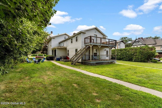 view of front of home with a wooden deck and a front yard