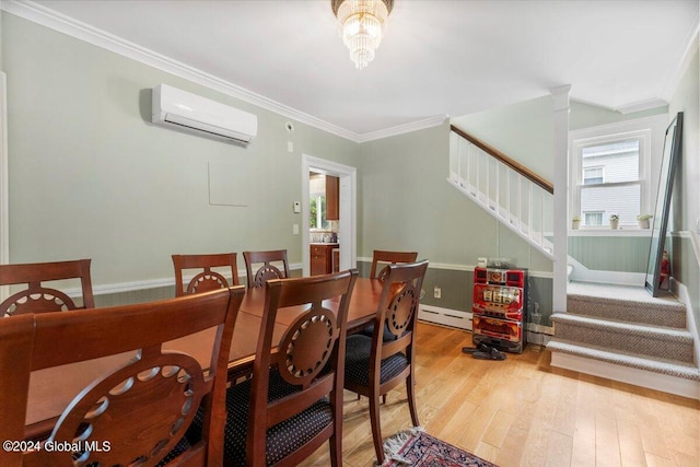 dining space featuring light hardwood / wood-style floors, a baseboard radiator, ornamental molding, and a wall mounted AC