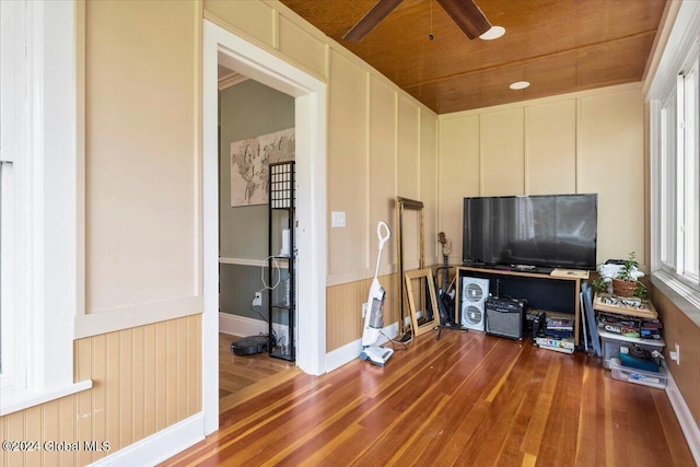 107-109 Lake Ave, Saratoga Springs, Inside, NY 12866 - living area featuring a decorative wall, ceiling fan, wainscoting, and wood finished floors