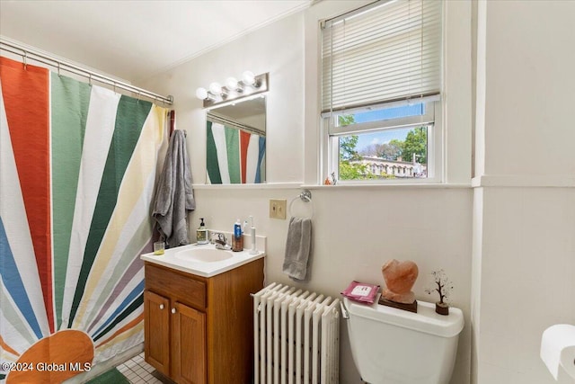 bathroom featuring vanity, tile patterned floors, ornamental molding, radiator, and toilet