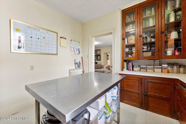 kitchen featuring ornamental molding and light tile patterned floors