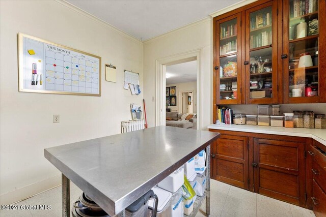 107-109 Lake Ave, Saratoga Springs, Inside, NY 12866 - kitchen featuring glass insert cabinets, light countertops, and ornamental molding