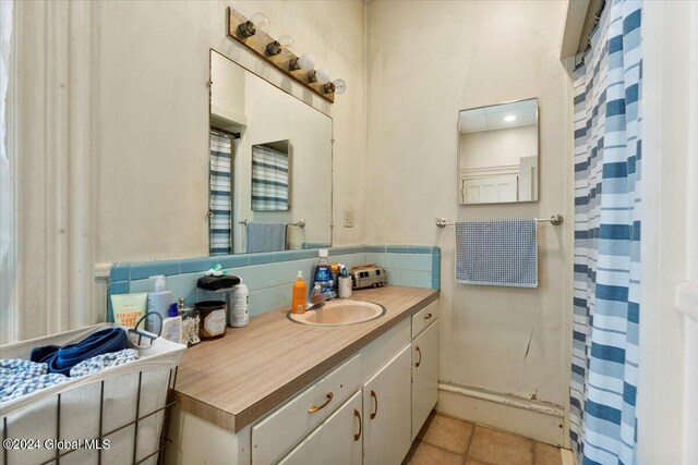 107-109 Lake Ave, Saratoga Springs, Inside, NY 12866 - bathroom featuring tile patterned flooring, vanity, and backsplash