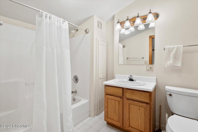 full bathroom featuring shower / bath combo with shower curtain, toilet, vanity, and tile patterned floors