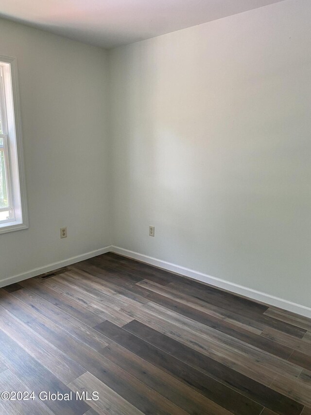 empty room with wood-type flooring