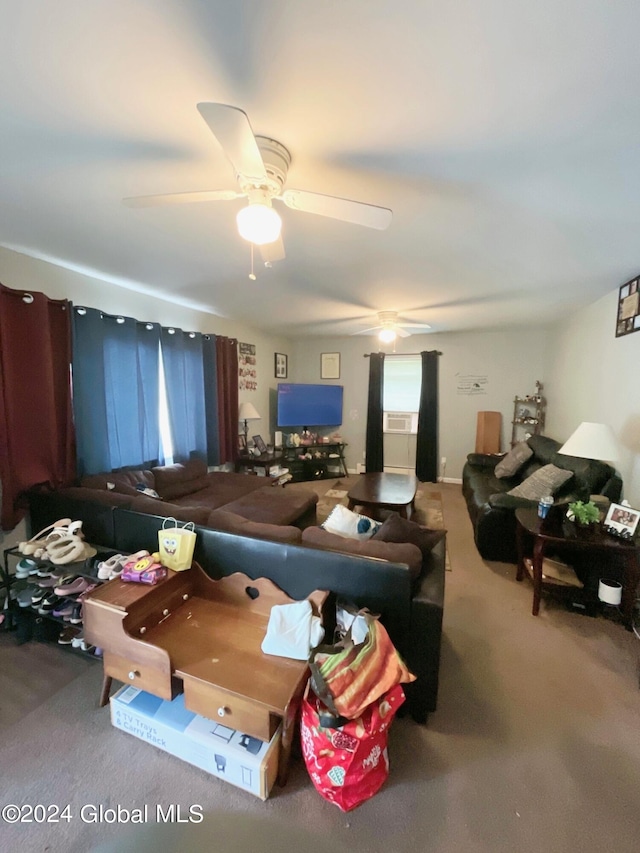 carpeted living room with ceiling fan