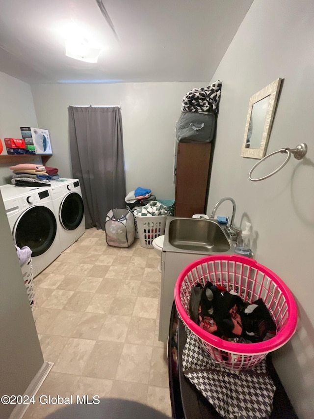 laundry room featuring sink and washing machine and dryer