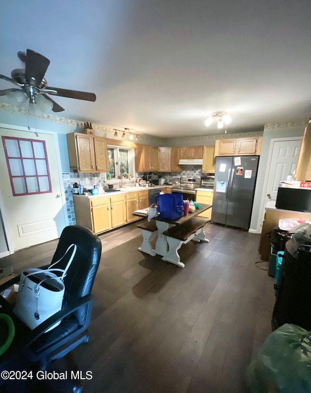 kitchen featuring dark wood-type flooring, stainless steel fridge, light brown cabinetry, and sink