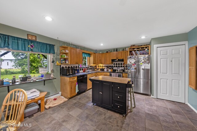 kitchen featuring tasteful backsplash, stainless steel appliances, tile patterned flooring, a kitchen island, and ventilation hood