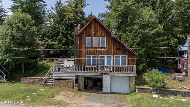 rear view of house with a deck