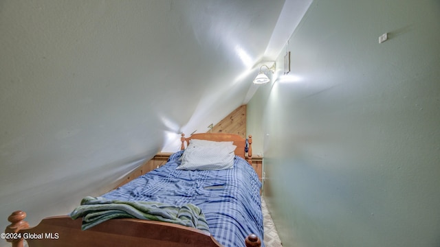 bedroom with lofted ceiling