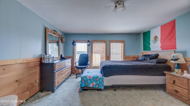 bedroom featuring light colored carpet