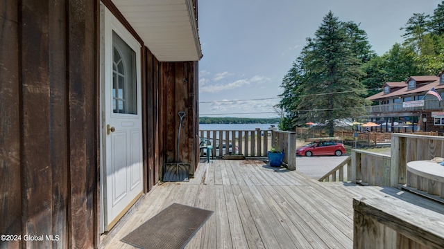 wooden terrace with a water view