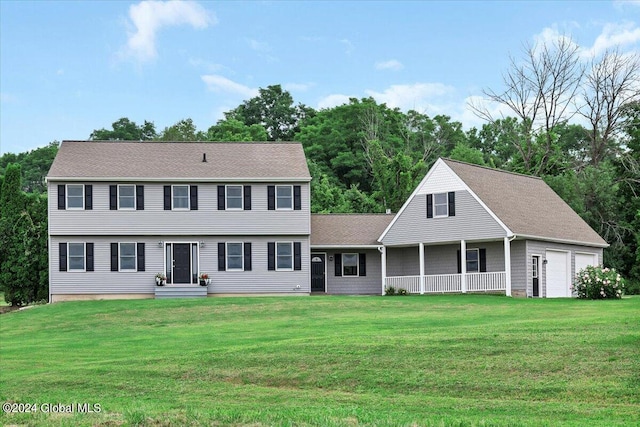 colonial-style house featuring a front lawn