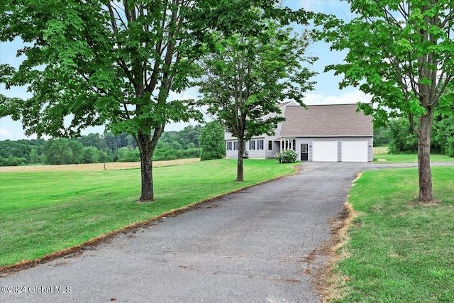 view of front facade with a garage and a front yard