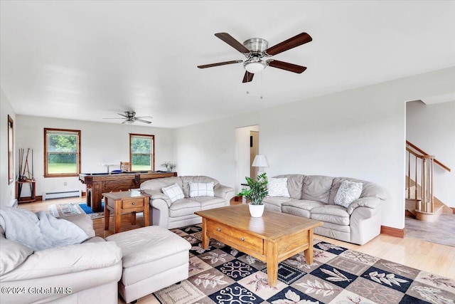 living room featuring light hardwood / wood-style floors, pool table, a baseboard radiator, and ceiling fan