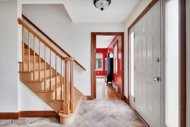 entryway featuring baseboard heating and light wood-type flooring