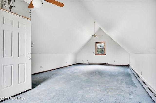 additional living space featuring a baseboard radiator, carpet, ceiling fan, and lofted ceiling