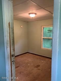 spare room featuring a paneled ceiling