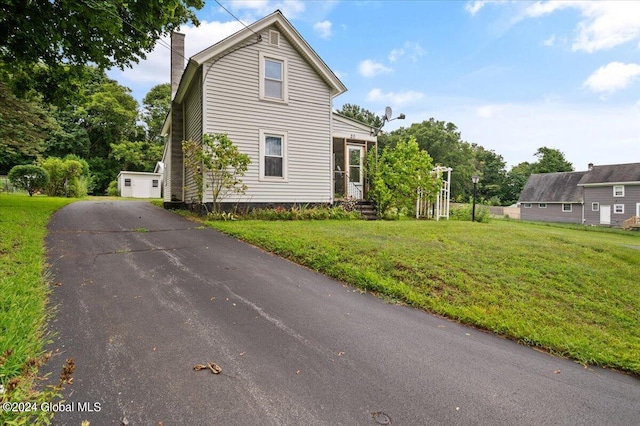 view of front property with a garage and a front yard