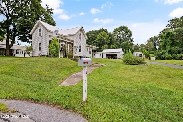 view of side of property with a lawn