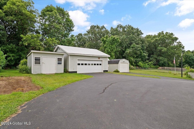 garage featuring a lawn