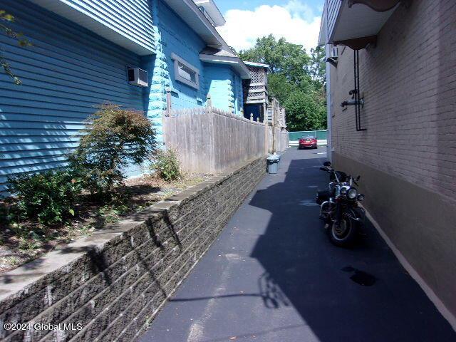 2119 Broadway, Schenectady, NY 12306 - view of home's exterior featuring a wall mounted AC and fence
