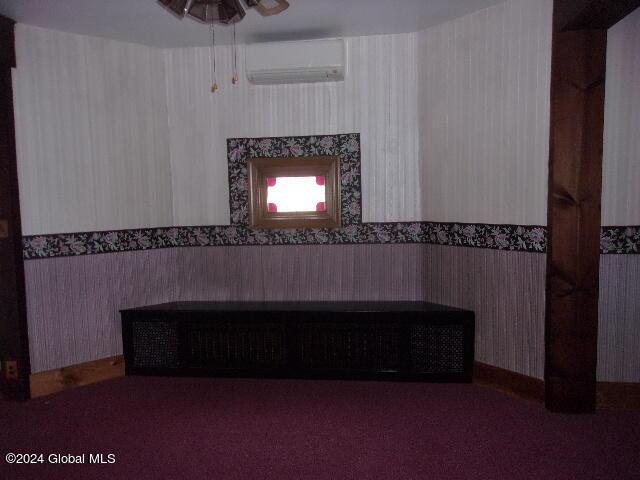 2119 Broadway, Schenectady, NY 12306 - interior space with an AC wall unit and ceiling fan