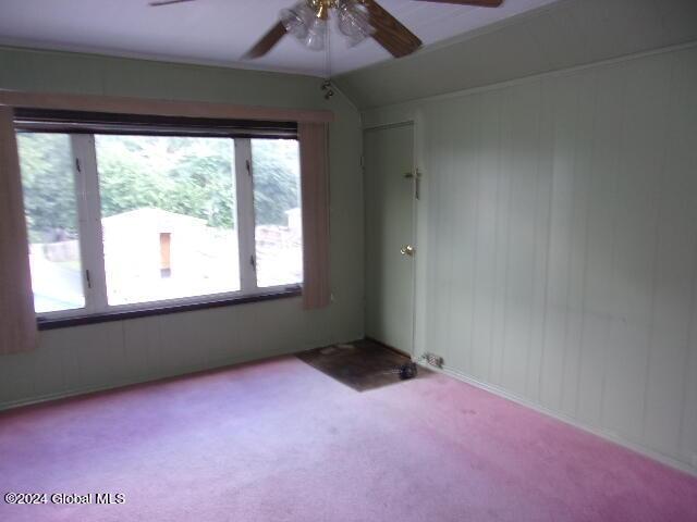2119 Broadway, Schenectady, NY 12306 - unfurnished room featuring lofted ceiling, carpet, and a ceiling fan