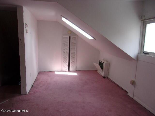 2119 Broadway, Schenectady, NY 12306 - bonus room with heating unit, lofted ceiling with skylight, and carpet