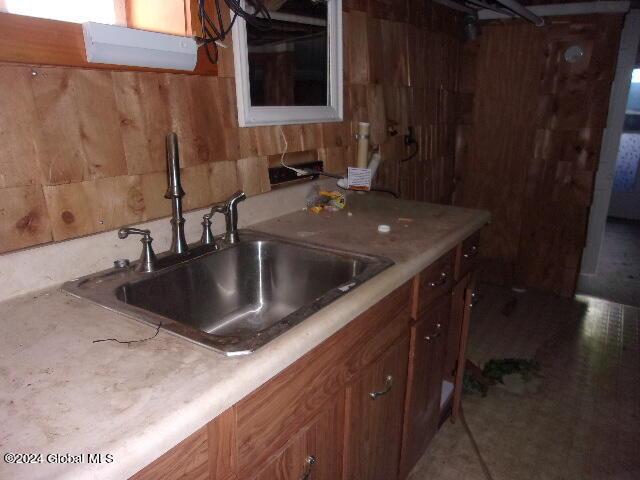 2119 Broadway, Schenectady, NY 12306 - kitchen with brown cabinetry, light countertops, and a sink