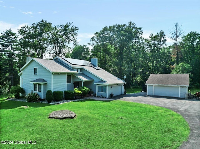 view of front of house with a front lawn and a garage