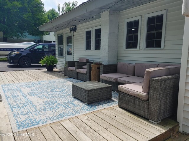 deck with an outdoor hangout area