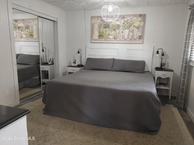 bedroom with a notable chandelier