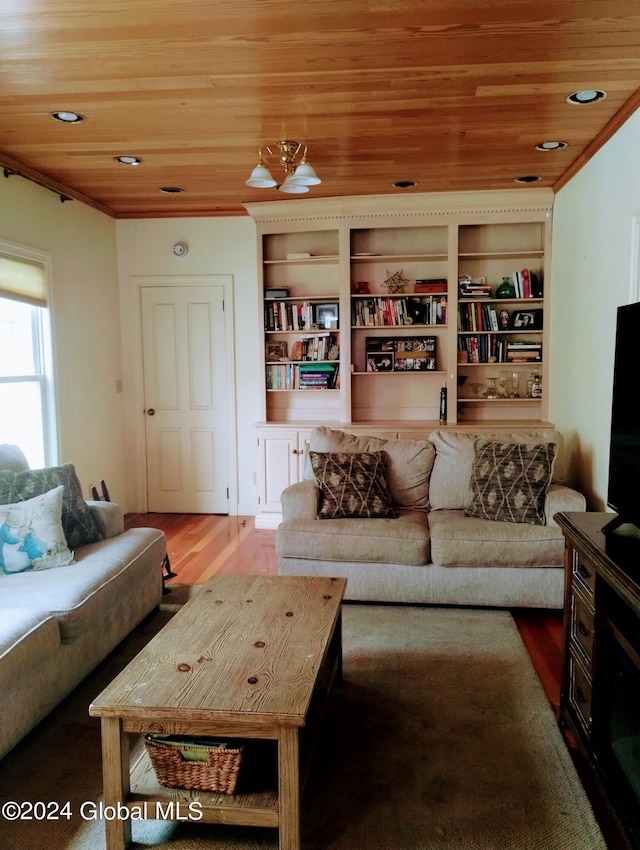 living area with wood ceiling, wood finished floors, and crown molding