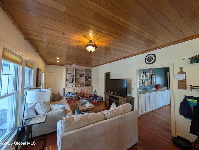 living room with wood ceiling, crown molding, and wood finished floors