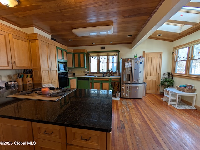 kitchen featuring black oven, built in microwave, light wood-type flooring, a peninsula, and stainless steel refrigerator with ice dispenser