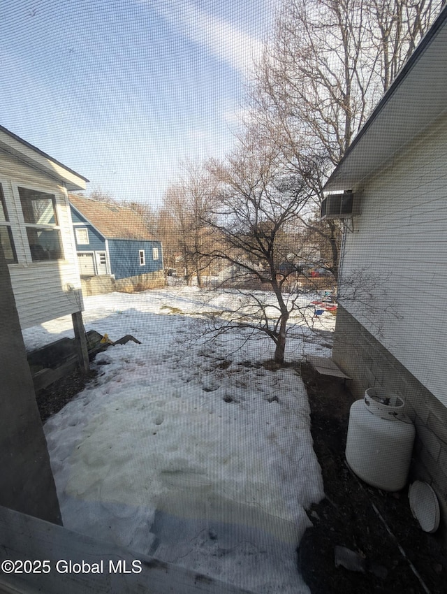 view of yard covered in snow