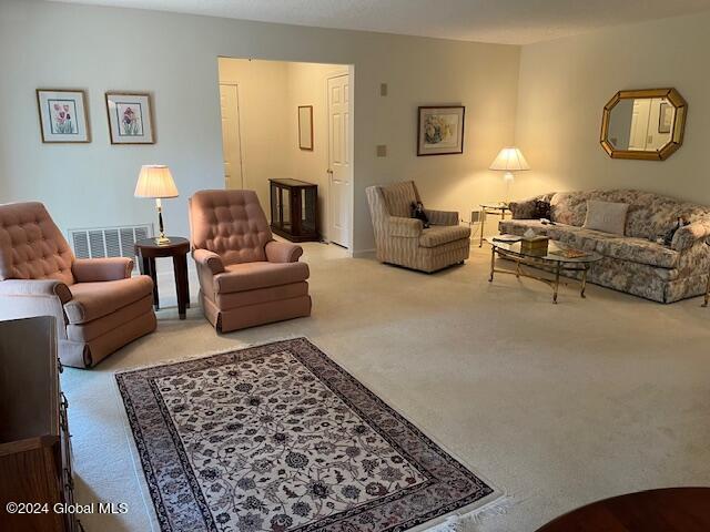 living room with light colored carpet